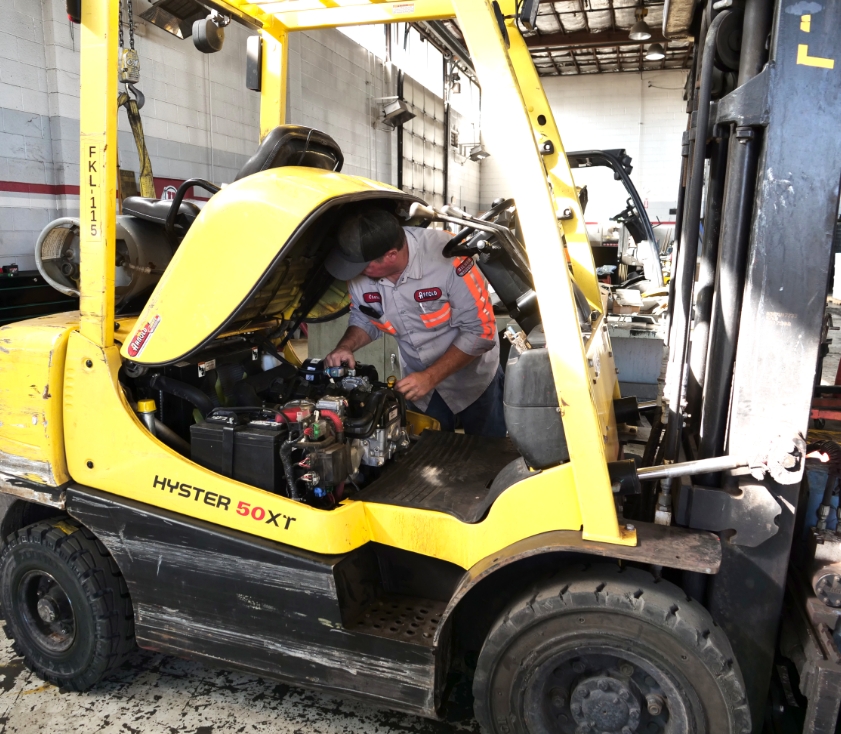 technician working on hyster 50xt forklift engine